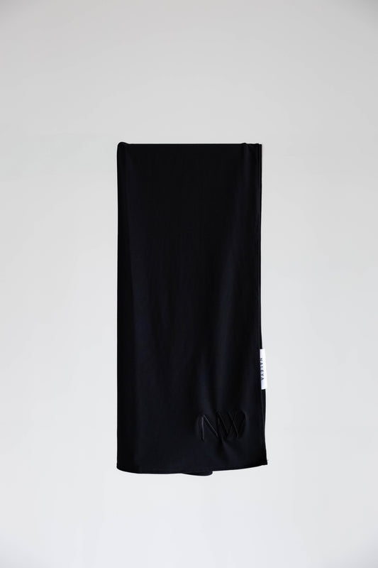 Premium jersey hijab in black by Naleya Wear, folded and displayed on a neutral background