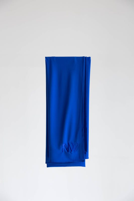Premium jersey hijab in blue by Naleya Wear, folded and displayed on a neutral background