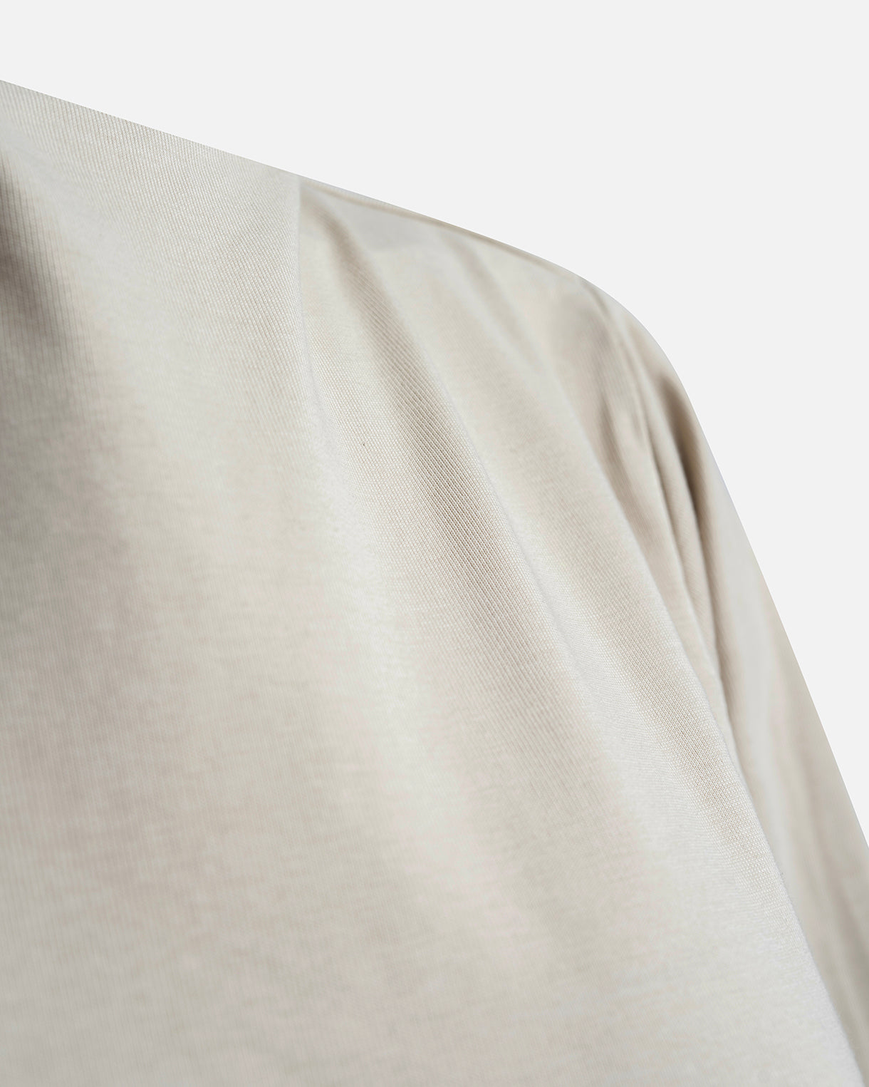 Eco-friendly abaya dress made of Sorona bio-cotton, lightweight and breathable material in color sage green, close up cotton material displayed on a neutral background