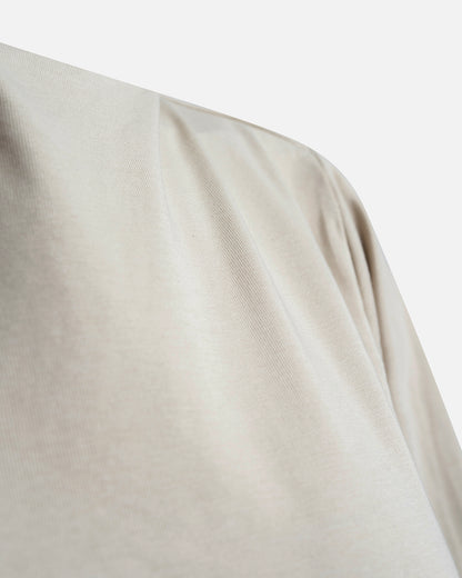 Eco-friendly abaya dress made of Sorona bio-cotton, lightweight and breathable material in color sage green, close up cotton material displayed on a neutral background