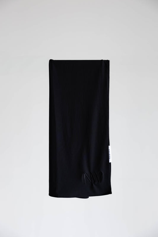 Premium jersey hijab in black by Naleya Wear, folded and displayed on a neutral background