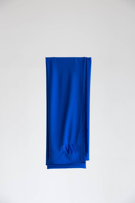 Premium jersey hijab in blue by Naleya Wear, folded and displayed on a neutral background