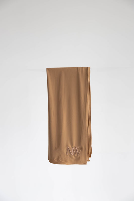 Premium jersey hijab in bronze brown by Naleya Wear, folded and displayed on a neutral background