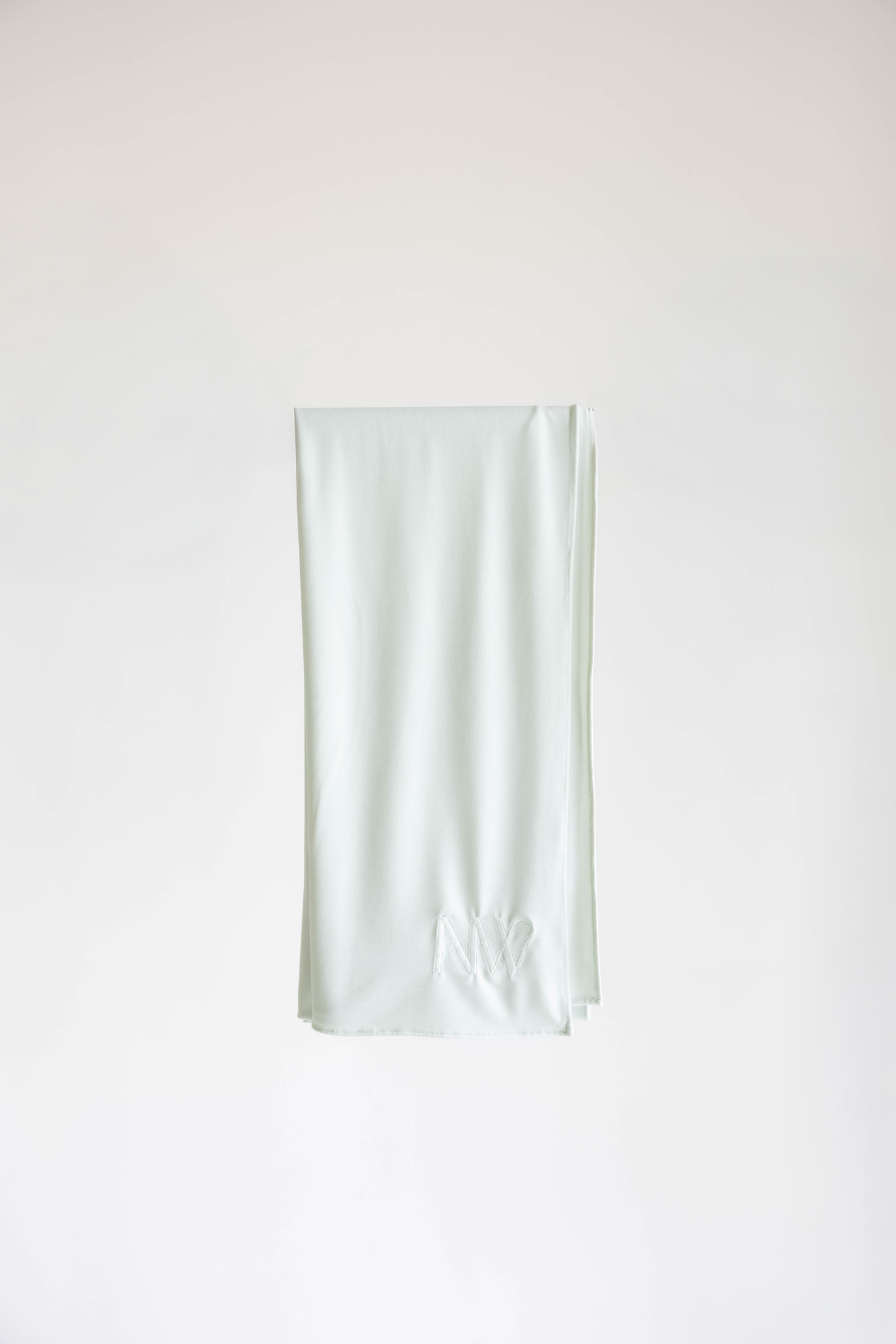 Premium jersey hijab in ice white by Naleya Wear, folded and displayed on a neutral background