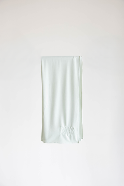 Premium jersey hijab in ice white by Naleya Wear, folded and displayed on a neutral background