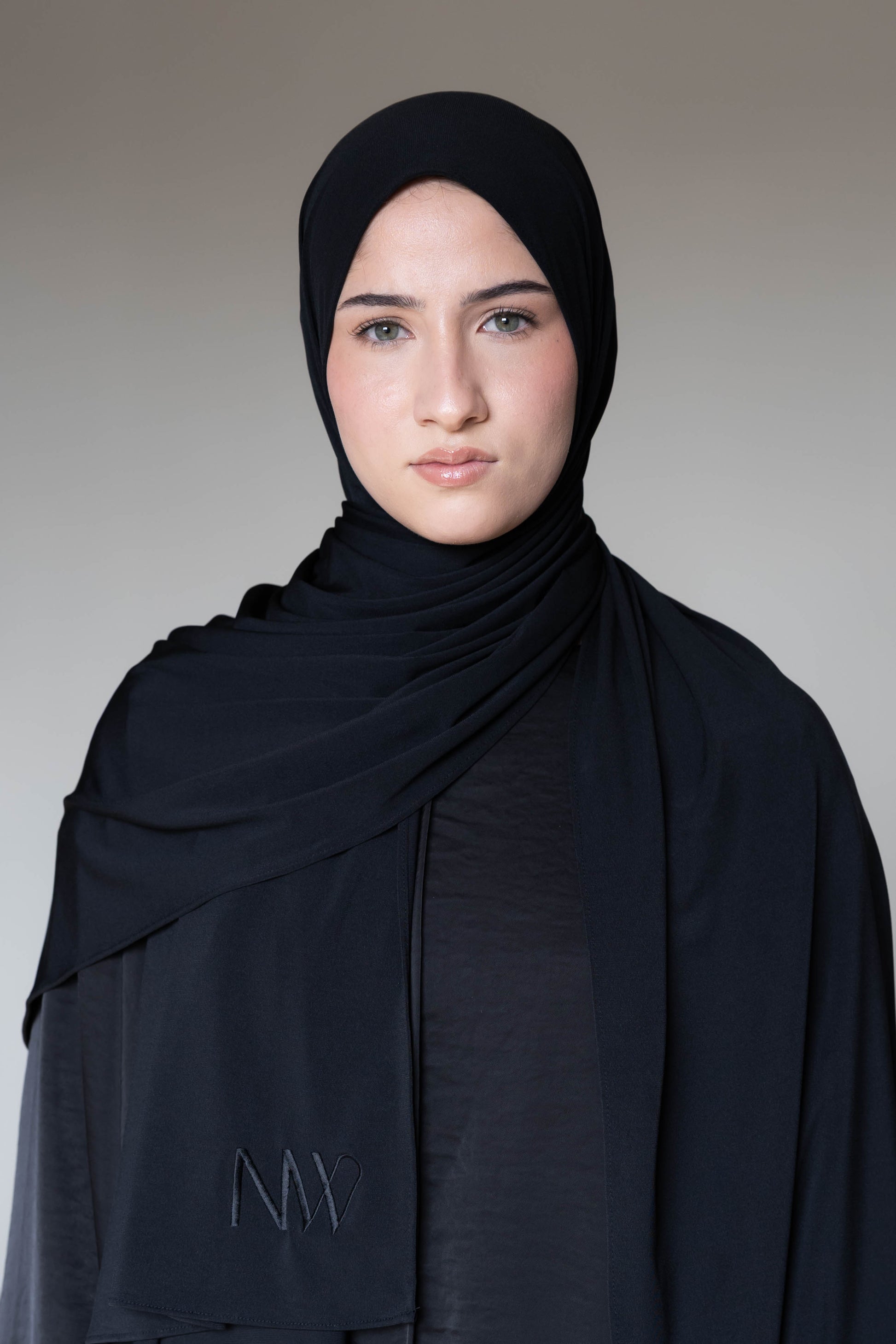 Model wearing a premium jersey hijab in black color by Naleya Wear