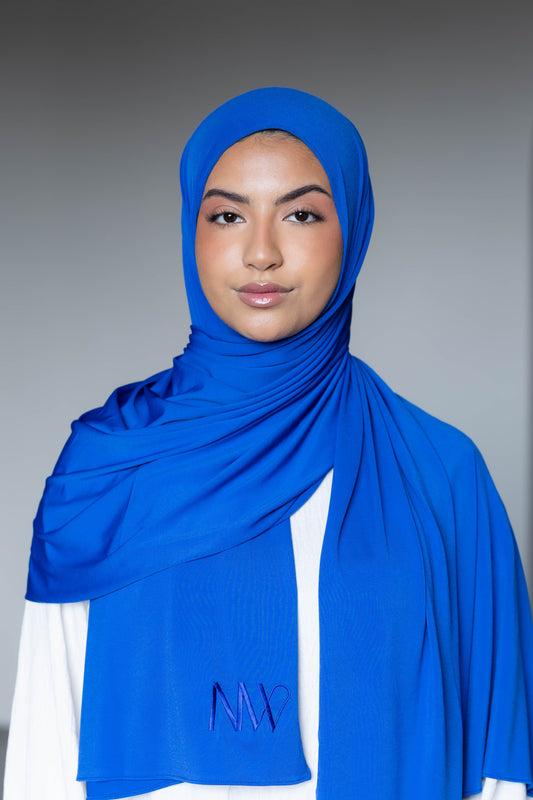 Model wearing a premium jersey hijab in blue color by Naleya Wear