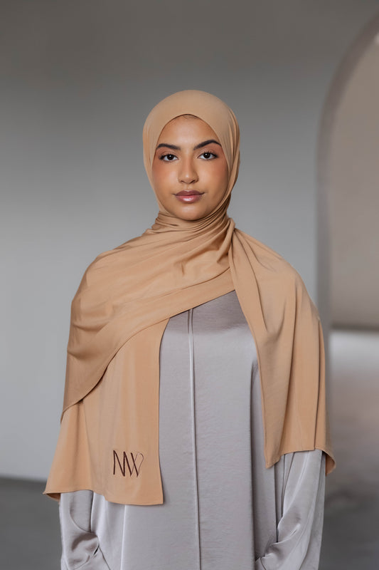 Model wearing a premium jersey hijab in bronze brown color by Naleya Wear