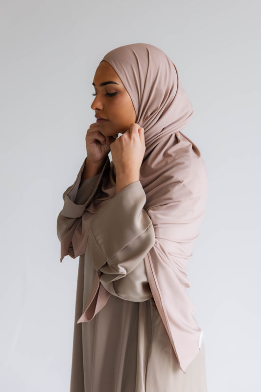 Model wearing a premium jersey hijab in brown color by Naleya Wear