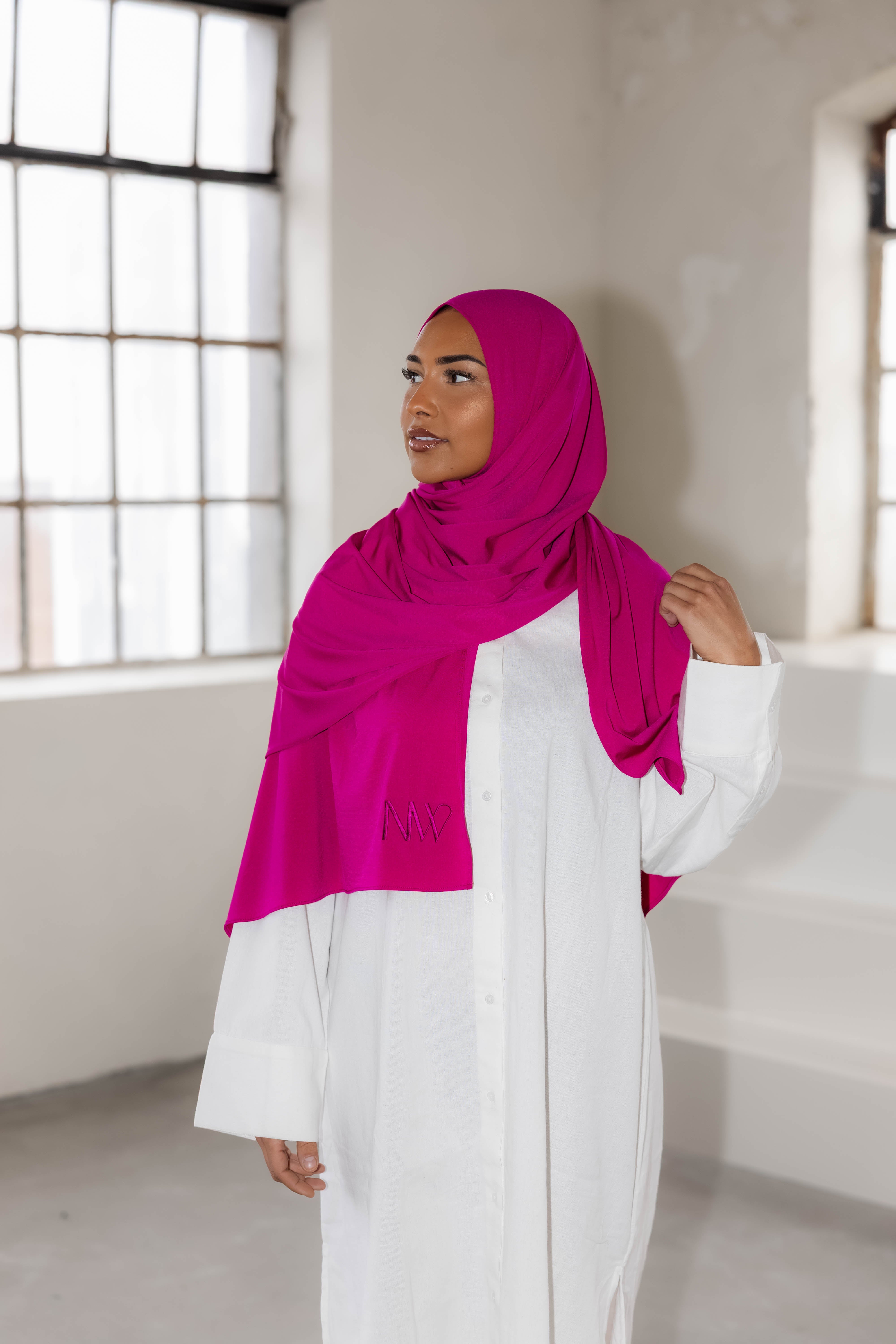 Model wearing a premium jersey hijab in pink color by Naleya Wear