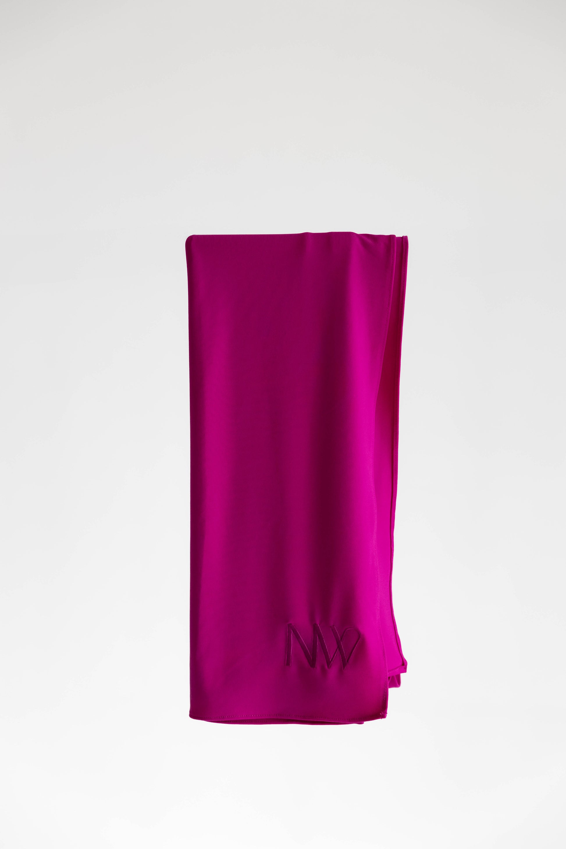 Premium jersey hijab in pink by Naleya Wear, folded and displayed on a neutral background